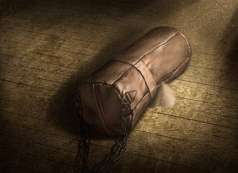 A leather punching bag lies on the concrete floor, completely beat up. Sand or grain of some kind spills out of a tear in the leather.
